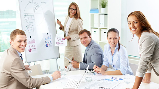 Image of confident partners looking at camera during presentation