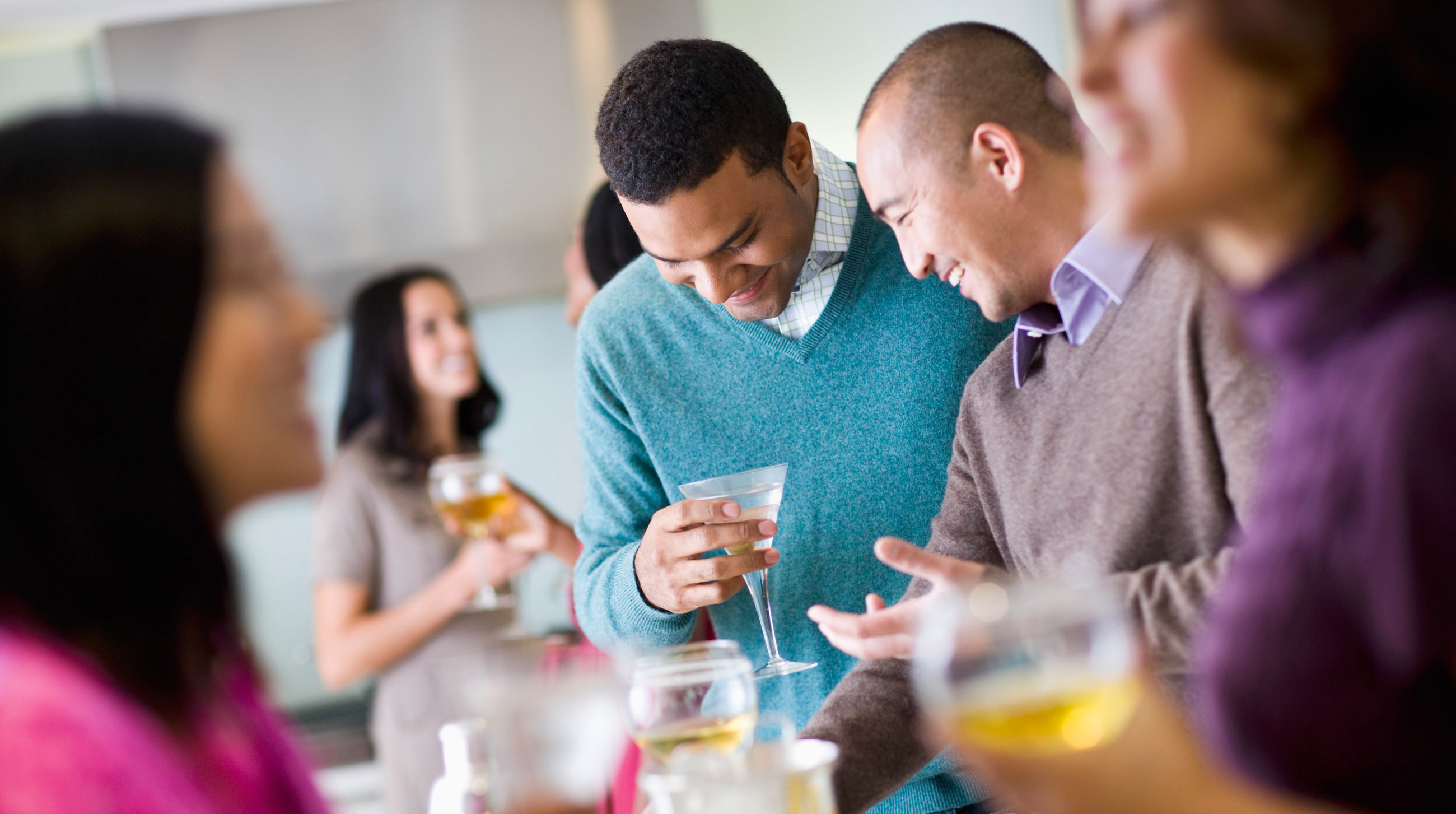 Friends Talking at a Party --- Image by © Tim Pannell/Corbis