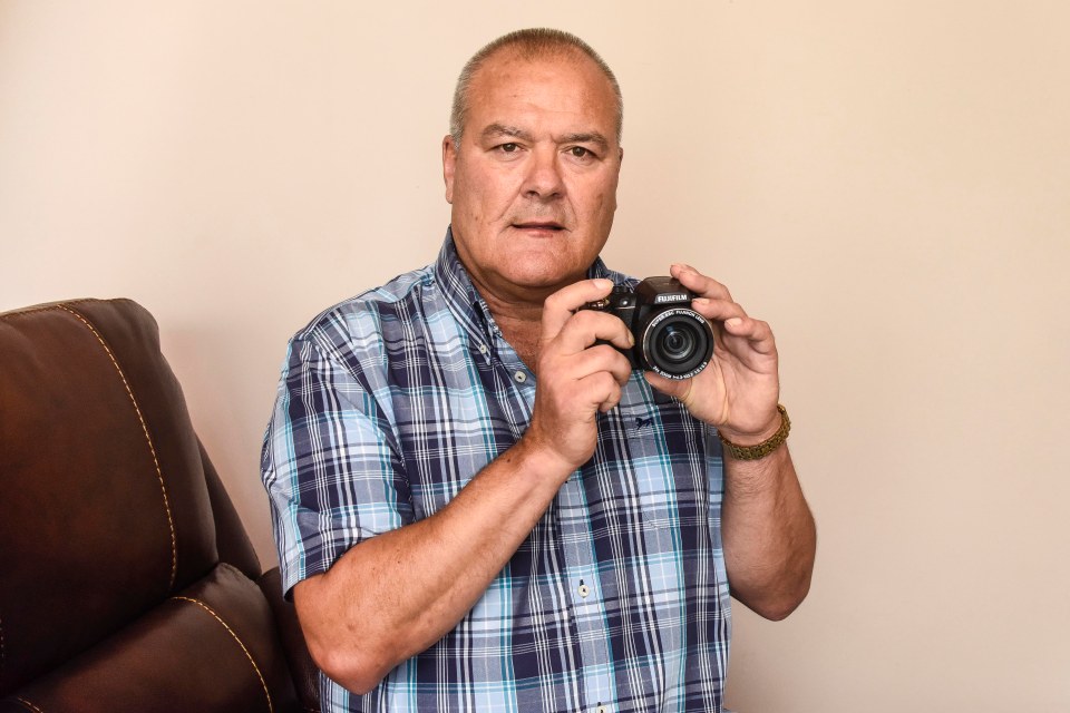 PIC BY MERCURY PRESS (PICTURED: DAVID LONSDALE, 58 WITH HIS CAMERA) A grandad spotted what he believes could be the spooky image of a ghost archer drawing his bow in the background of a 26-year-old family snap. David Lonsdale, 58, took the picture of his two daughters stood smiling in front of Rhuddlan castle in Wales on a trip with daughters Sarah and Fiona, then aged 10 and six, more than a quarter of a century ago. But it was only when the retired fork lift driver was flicking some old photos last week when he spotted a haunting figure stood inside an alcove of the castle looming in the background. David believes the image shows a dark figure peering round the 13th century castle walls, with black eyes and hands up as if drawing a bow in their direction. SEE MERCURY COPY