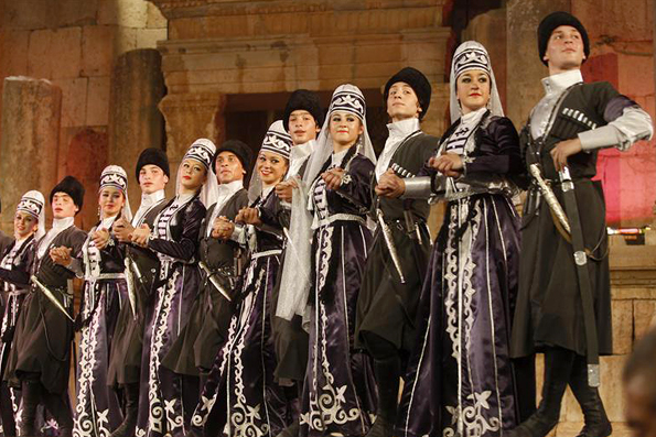 Dancers from the Circassian minority perform dances from their old folklore heritage at the Southern theatre during the Jerash Festival in the ancient city of Jerash July 26, 2011. The Jerash festival for culture and art is a celebration of both Jordanian and international culture featuring poetry recitals, gymnastic performances, dance, plays and comedy. Picture taken July 26, 2011. REUTERS/Stringer (JORDAN - Tags: ENTERTAINMENT)