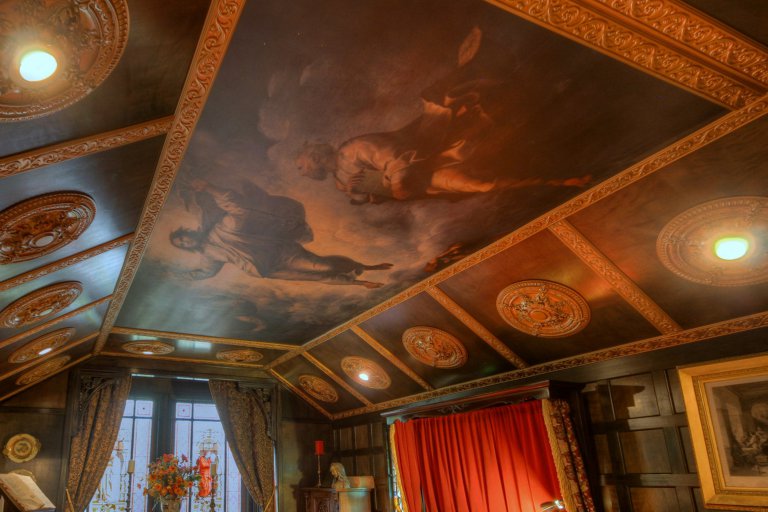 PICS BY TYLER BEASLEY / CATERS NEWS - (PICTURED: The rooms have paintings that date back to the 17th century and furniture from 11th - the B&B was built in 1975 and renovated for 35 years by the owner who wanted to give it a royal and noble appearance, some have compared to stepping into Hogwarts, hidden from the rest of the world) - This B&B truly is fit for a King! Breath-taking Victorian castle hidden inside modest suburban bed and breakfast. Looking at the exterior of this three-bedroom house youd never believe whats hidden inside. The Castle of Lady Shannon, in Newport in Oregon, USA, holds furniture dating back to the 11th Century and dcor that youd expect to from Victorian Royalty. The former owner Lady Almine Barton started renovating the home in 1975 to make it look like something from the renaissance period and feel similar to living in a Rembrandt painting. Now the home boasts stained glass windows from Lancaster Cathedral in 1752, Knights chairs used on battle fields during early British conflicts, four-poster beds, beautiful ceiling paintings and more. Earlier this year it was put on the market for 99,000 and has since been transformed into a bed and breakfast capable of hosting six people at a time. Visitors to the Castle of Lady Shannon have compared the experience to going to Hogwarts and the B&B is now taking bookings. - SEE CATERS COPY