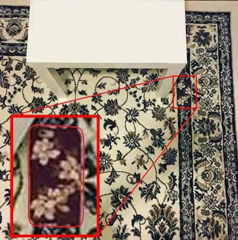 Find the mobile phone on the carpet