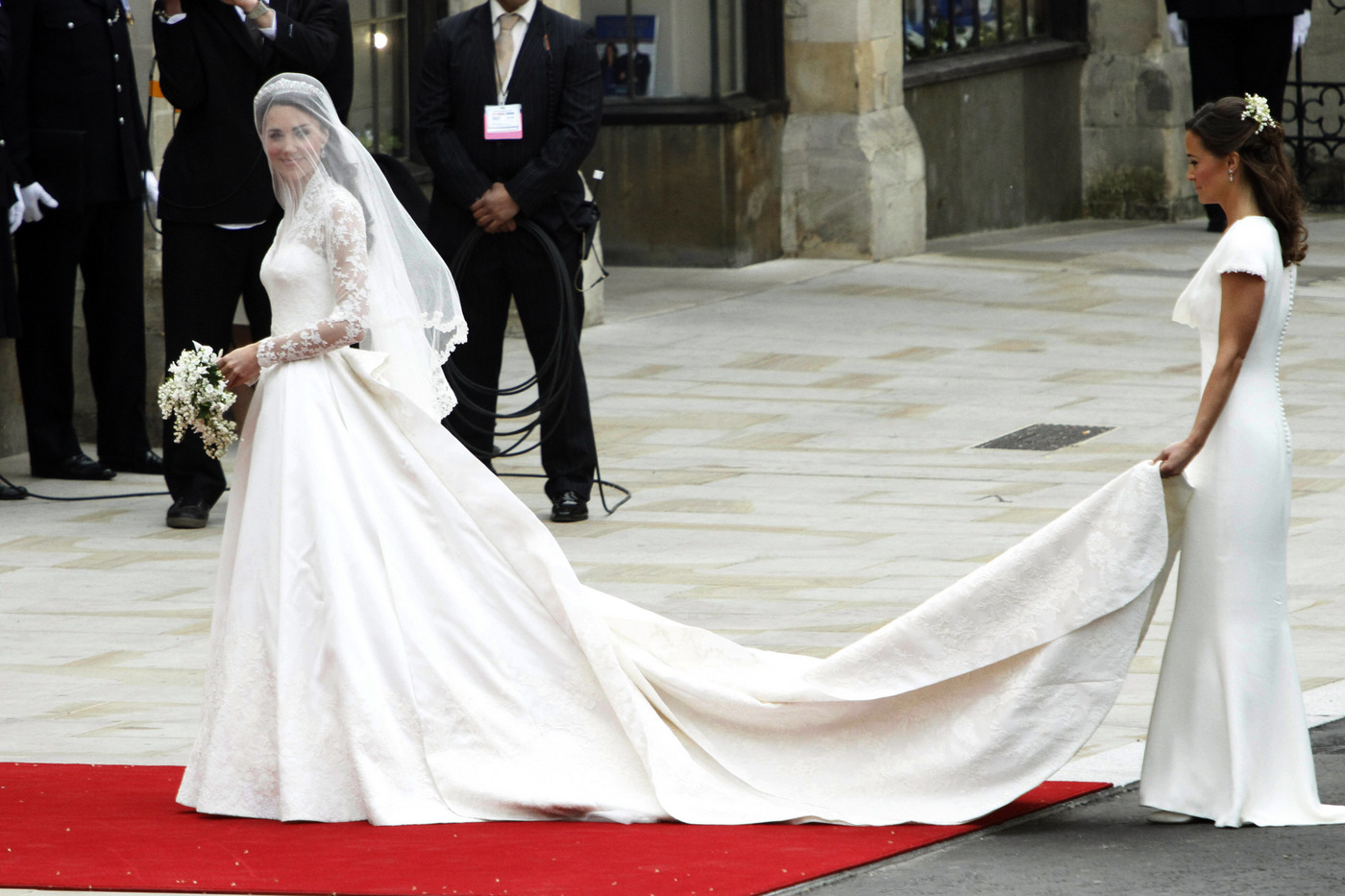 54305, LONDON, UNITED KINGDOM - Friday April 29 2011. Kate Middleton reveals her McQueen gown as she arrives with sister Pippa at Westminster Abbey. Masses of crowds lined the streets to catch a glimpse of the new Duke and Duchess of Cambridge emerge from the church. **NORTH AMERICAN USE ONLY*** Photograph: ©PacificCoastNews.com **FEE MUST BE AGREED PRIOR TO USAGE** **E-TABLET/IPAD & MOBILE PHONE APP PUBLISHING REQUIRES ADDITIONAL FEES** UK OFFICE:+44 131 557 7760/7761 US OFFICE:1 310 261 9676