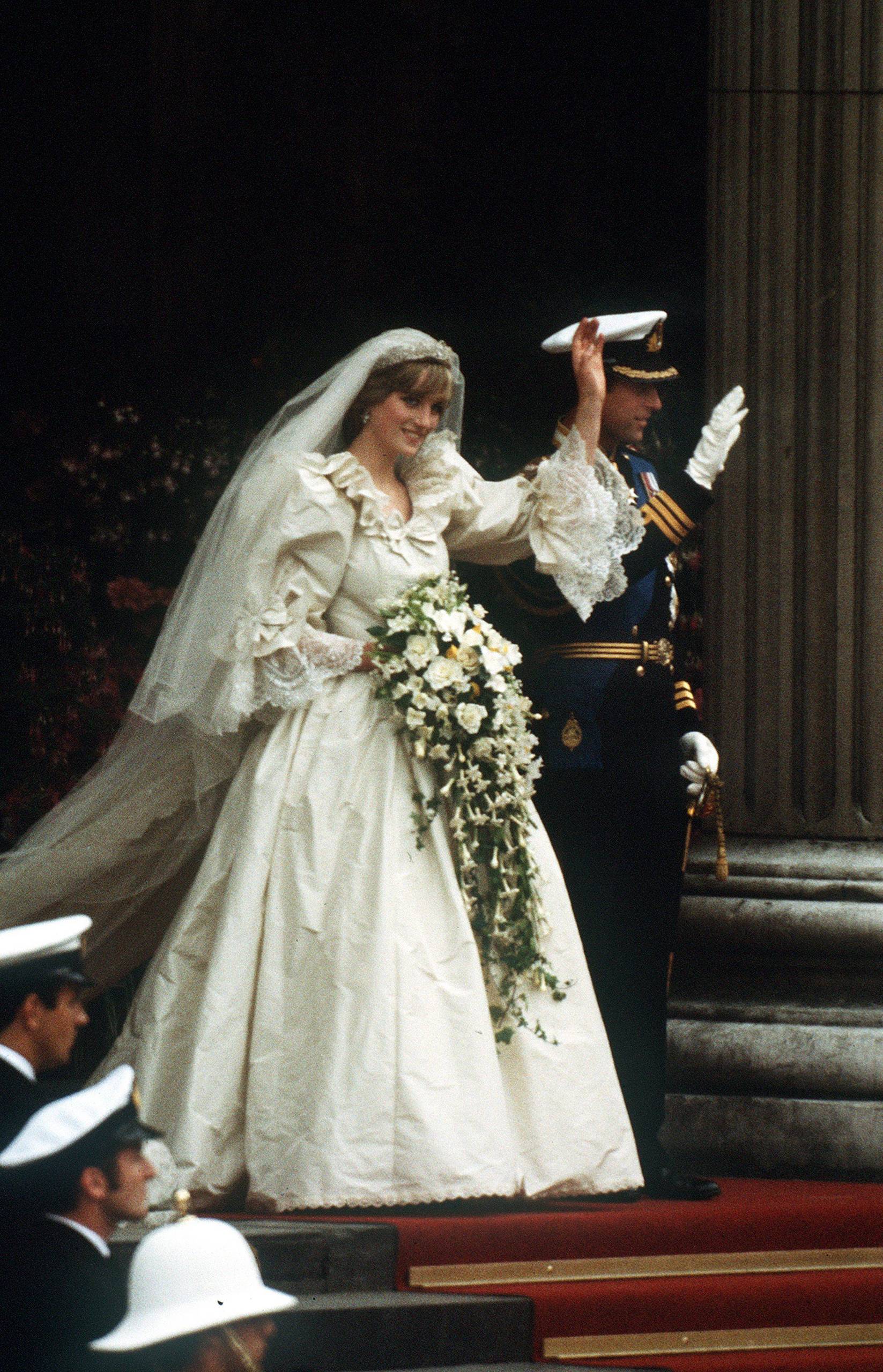 The Prince and Princess of Wales leave St Paul's Cathedral after their wedding, 29th July 1981. She wears a wedding dress by David and Elizabeth Emmanuel and the Spencer family tiara. (Photo by Jayne Fincher/Princess Diana Archive/Getty Images)
