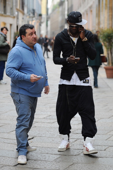MILAN, ITALY - MARCH 05:  Agent Mino Raiola and Mario balotelli are seen on March 5, 2013 in Milan, Italy.  (Photo by Jacopo Raule/Getty Images)