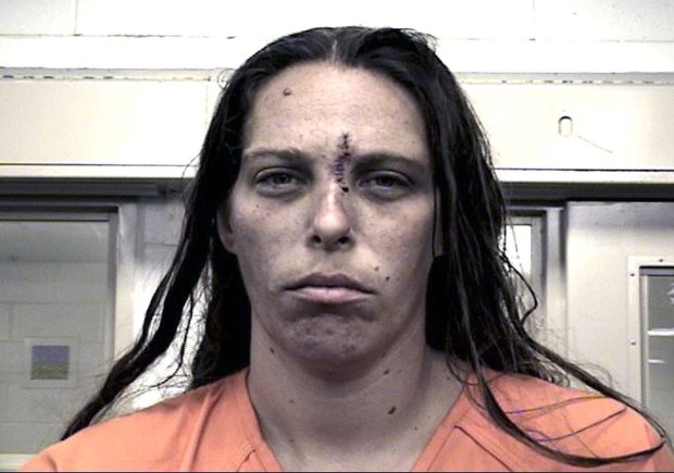 This Aug. 25, 2016 booking photo provided by the Metropolitan Detention Center shows Michelle Martens. New Mexico Gov. Susana Martinez says what happened to the little girl "is unspeakable and justice should come down like a hammer" on whoever is responsible. Officer Tanner Tixier said in a news release Wednesday, Aug. 24, that charges are being filed against Martens, Fabian Gonzales, and Jessica Kelley.(Metropolitan Detention Center via AP)