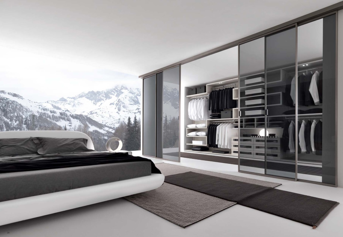enchanting-bedroom-with-walk-in-wardrobe-design-idea-presented-with-transparent-wall-reflecting-snow-mountain-scenery-also-sliding-door-covering-clothes-wardrobe