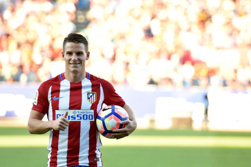 (FILES) This file photo taken on July 31, 2016 shows Atletico de Madrid's new signing French forward Kevin Gameiro posing with a ball during his presentation at the Vicente Calderon stadium in Madrid. Pogba, Umtiti, Digne, Dembele, Kante, Gameiro... French players continue to be popular in Europe, and stirred the transfer market this summer after a beautiful Euro 2016 championship for the French Team and repeated success of the younger players selections. / AFP PHOTO / GERARD JULIEN