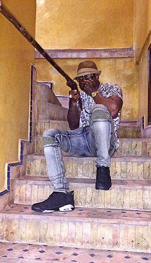 PIC FROM CATERS NEWS - (PICTURED: Levi Watson sits on a staircase. ) - A brazen drug dealer was jailed for seven years -after being snared by Instagram pics showing his Champagne lifestyle. Levi Watson posted a range of boasting snaps on the social media site - featuring Lamborghinis, Rolex watches, baths full of cash and a Premier League footballer. Watson, 29, from Wolverhampton, was jailed for his role in a drugs ring supplying cocaine and heroin, as part of a huge drugs bust by West Midlands Police. Dealers in the ring got sentenced to more than 130 years behind bars between them. In snaps and videos posted on his Instagram page, which has more than 4,500 followers, Watson regularly boasted about his lavish lifestyle abroad - despite telling cops he had no steady income and lived in Wolverhampton. SEE CATERS COPY.