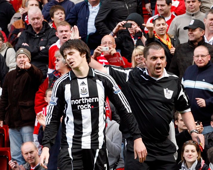 Newcastle's Joey Barton, left, reacts after being sent off by referee Phil Dowd, right, for a tackle on Liverpool's Xabi Alonso, unseen, during their English Premier League soccer match at Anfield Stadium, Liverpool, England, Sunday, May 3, 2009. (AP Photo/Paul Thomas) ** NO INTERNET/MOBILE USAGE WITHOUT FOOTBALL ASSOCIATION PREMIER LEAGUE (FAPL) LICENCE. CALL +44 (0) 20 7864 9121 or EMAIL info@football-dataco.com FOR DETAILS **
