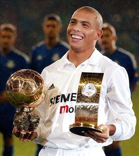 Real Madrid's Brazilian Ronaldo poses with his trophies, the Golden Ball and The Best Player Fifa before Real Madrid's Centennial match against a FIFA world side in Santiago Bernabeu Stadium of Madrid 18 December, 2002.