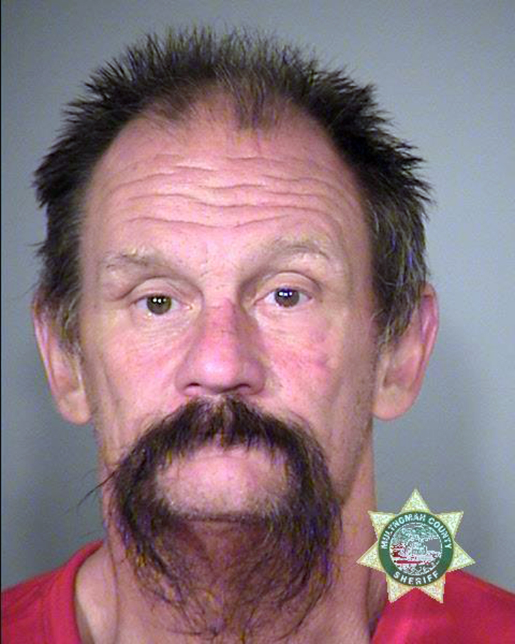 This undated photo provided by the Multnomah County Sheriff's office shows David Dahlman. Dahlman was arrested outside a school in Portland, Ore., Thursday, Oct. 6, 2016, following a report that a man in a clown mask was chasing kids. Police say Dahlman, who was also wearing boxing gloves, alarmed students by shadow boxing toward them as he stood outside school windows and threatened an assistant principal who came out to speak to him. (Multnomah County Sheriff's Office via AP)
