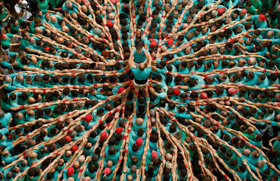 Castellers de Vilafranca start to form a human tower called "castell" during a biannual competition in Tarragona city, Spain, October 2, 2016. REUTERS/Albert Gea