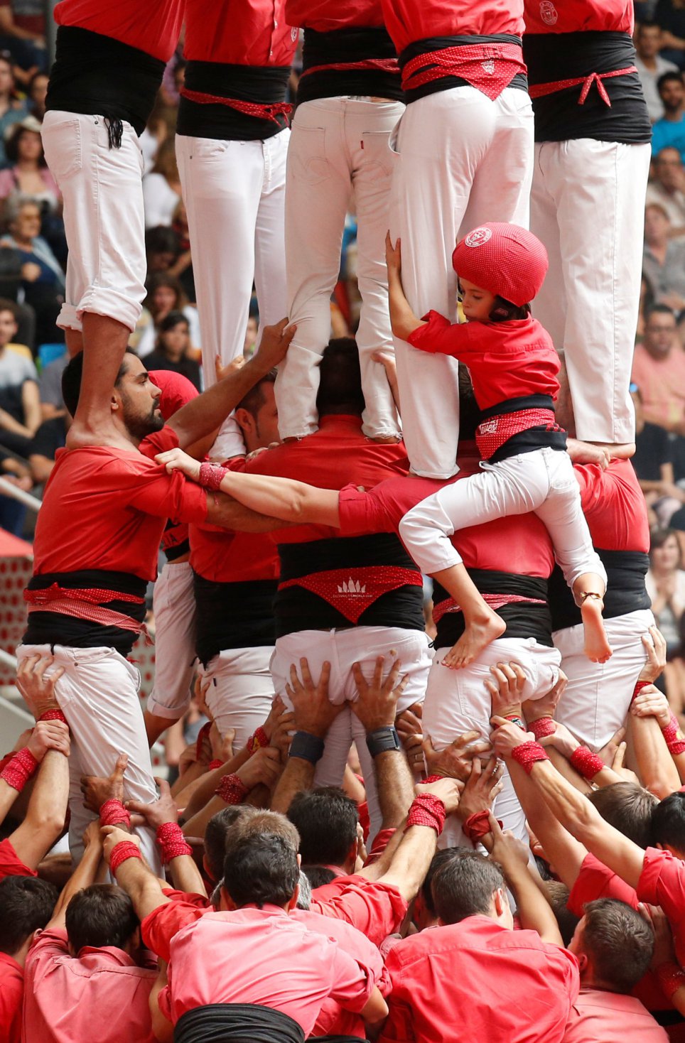 Colla Joves Xiquets de Valls form a human tower called "castell" during a biannual competition in Tarragona city, Spain, October 2, 2016. REUTERS/Albert Gea