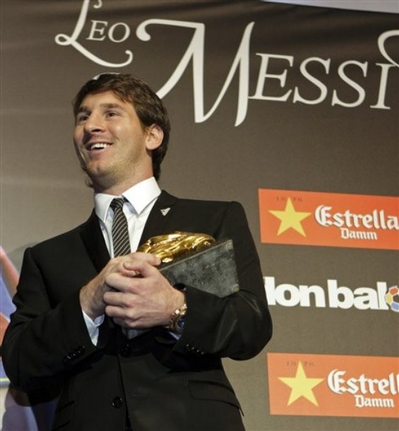 In this image released by the magazine Don Balon, FC Barccelona's Lionel Messi poses with the Bota de Oro (Golden Boot) trophy awarded to him as top scorer of all European Leagues, at a ceremony in Barcelona, Spain, Thursday, Sept. 30, 2010. Messi now joins Marco van Basten, Ronaldo and Cristiano Ronaldo as the only players to have won all three major individual awards: the Golden Boot, FIFA World Player of the Year and the Golden Ball, given to the European footballer of the year (AP Photo) ** EDITORIAL USE ONLY NO SALES **