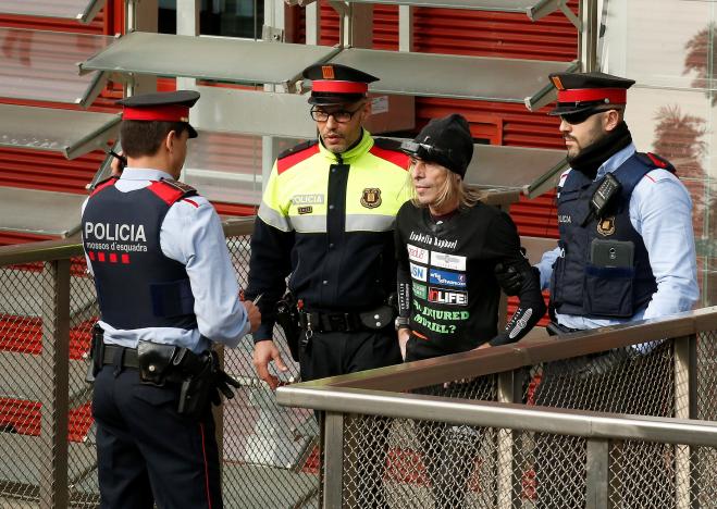 French climber Alain Robert also known as "The French Spiderman" is detained by police after scaling the 38-story skyscraper Torre Agbar in Barcelona