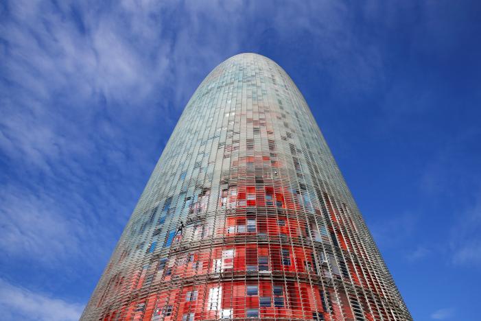 French climber Alain Robert, also known as "The French Spiderman", scales the 38-story skyscraper Torre Agbar in Barcelona