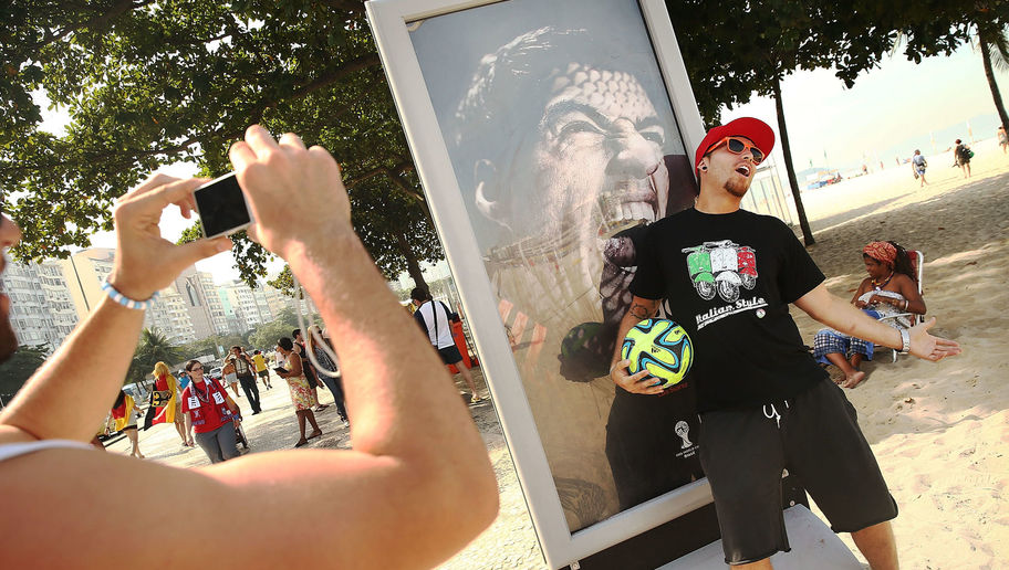 Soccer Fans Mock Suarez Biting Incident At World Cup