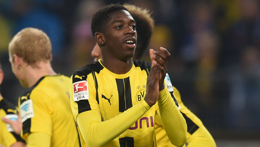 Dortmund's French midfielder Ousmane Dembele (R) celebrates during the German first division Bundesliga football match between Hamburg SV and BVB Borussia Dortmund in Hamburg, northern Germany, on November 5, 2016.  / AFP / CARMEN JASPERSEN / RESTRICTIONS: DURING MATCH TIME: DFL RULES TO LIMIT THE ONLINE USAGE TO 15 PICTURES PER MATCH AND FORBID IMAGE SEQUENCES TO SIMULATE VIDEO. == RESTRICTED TO EDITORIAL USE == FOR FURTHER QUERIES PLEASE CONTACT DFL DIRECTLY AT + 49 69 650050         (Photo credit should read CARMEN JASPERSEN/AFP/Getty Images)