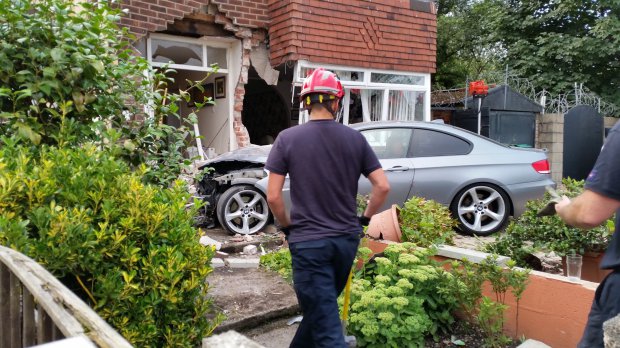 The BMW smashed through the front door of the house