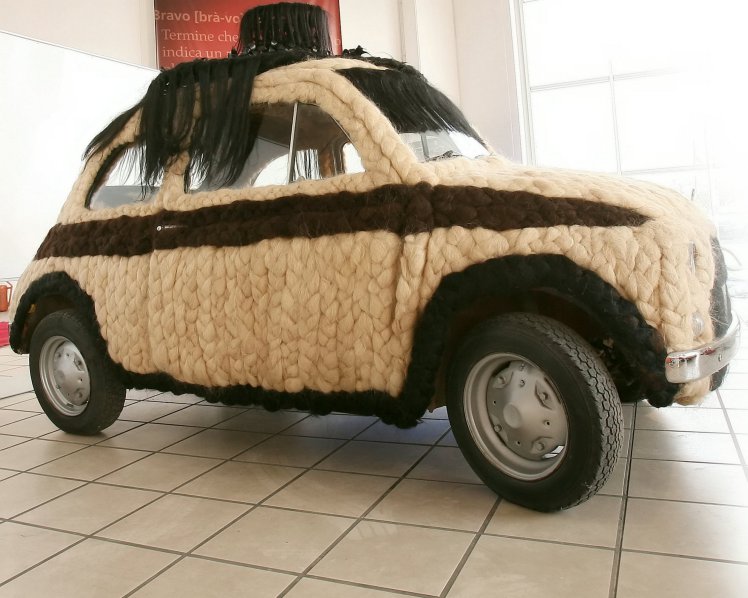 The Fiat 500 covered in human hair. See SWNS story SWHAIR; A stylist is selling her one-of-a-kind car after spending £75,000 decking it out with 100kg of HUMAN HAIR. Lucia Mugno spent 20 days covering the 1975 Fiat 500 with huge braids of black, blonde and brown hair from India. She transformed the humble city car into a one-of-a-kind machine with the interior including the STEERING WHEEL covered in hair. The car is understood to run perfectly although it is recommended Lucia avoids driving it around her hometown of Padula, Italy, when it is raining. The Fiat 500 is now in the Guinness Book of Records as The Hairiest Car in the World. Lucia is now selling the Fiat 500 through the Catawiki auction website - with the online marketplace giving the one-off motor a £110,000 estimate.