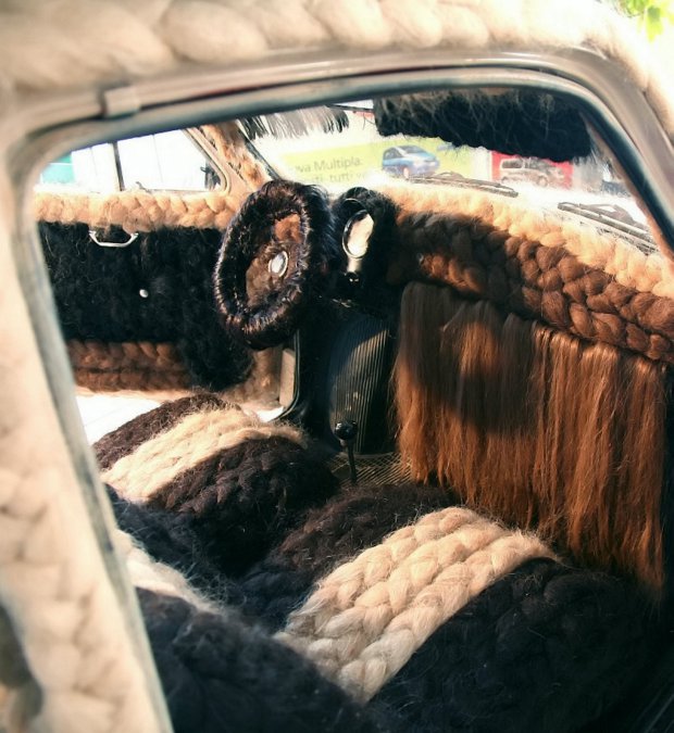 The Fiat 500 covered in human hair. See SWNS story SWHAIR; A stylist is selling her one-of-a-kind car after spending £75,000 decking it out with 100kg of HUMAN HAIR. Lucia Mugno spent 20 days covering the 1975 Fiat 500 with huge braids of black, blonde and brown hair from India. She transformed the humble city car into a one-of-a-kind machine with the interior including the STEERING WHEEL covered in hair. The car is understood to run perfectly although it is recommended Lucia avoids driving it around her hometown of Padula, Italy, when it is raining. The Fiat 500 is now in the Guinness Book of Records as The Hairiest Car in the World. Lucia is now selling the Fiat 500 through the Catawiki auction website - with the online marketplace giving the one-off motor a £110,000 estimate.
