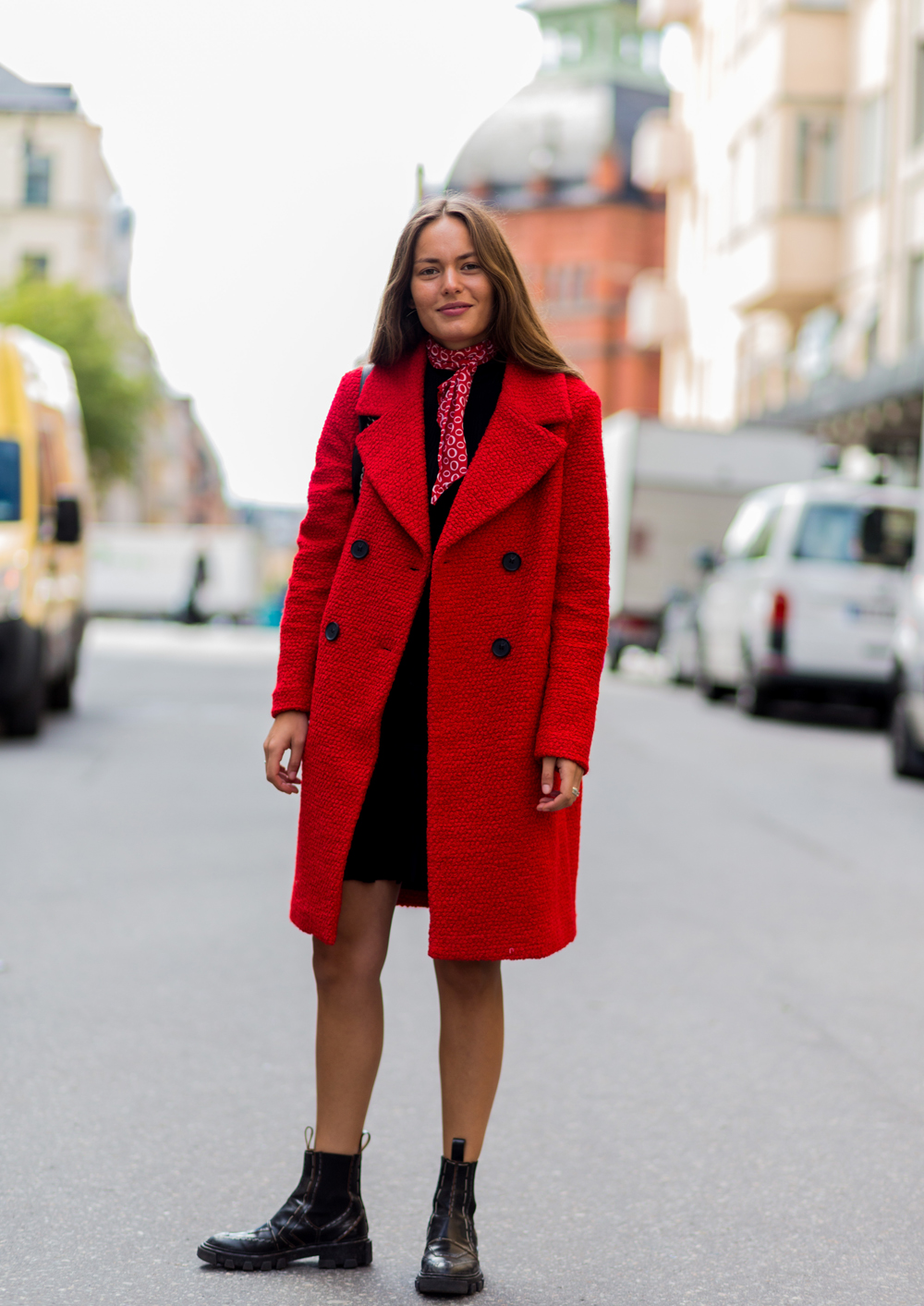 STOCKHOLM, SWEDEN - AUGUST 30: Victoria Saceanu wearing a red coat, black Chelsea boots, a red bandana scarf and black dress outside Lexington during the second day of the Stockholm Fashion Week Spring/Summer 2017 on August 30, 2016 in Stockholm, Sweden. (Photo by Christian Vierig/Getty Images)
