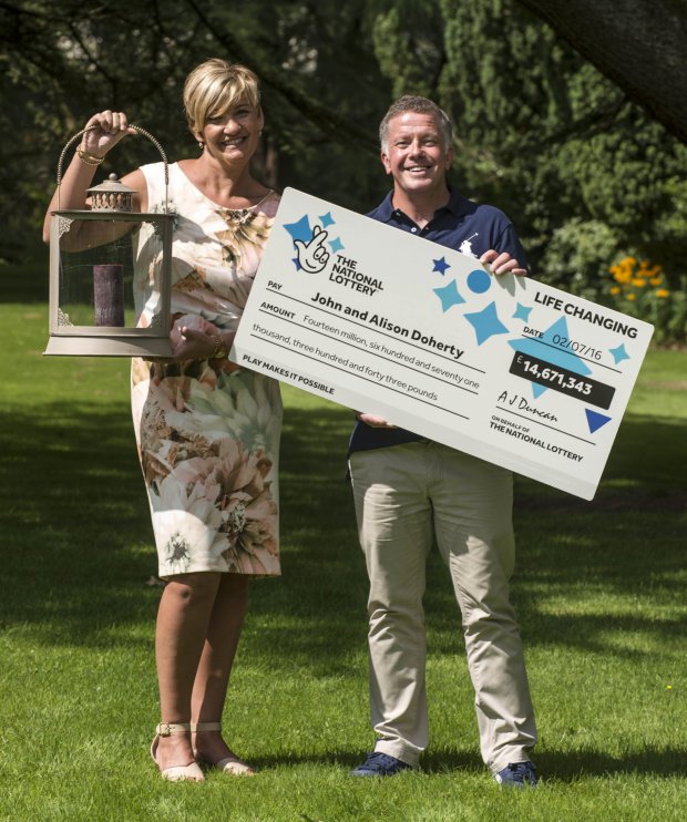 Alison Doherty and John Doherty, from Elderslie in Renfrewshire, as they celebrate winning £14,671,343 from the Lotto draw on Saturday, July 2, at Mar Hall in Bishopton, Scotland. PRESS ASSOCIATION Photo. Picture date: Tuesday July 19, 2016. Mrs Doherty holds the decorative lantern that they hid the winning ticket under whilst they went on holiday for two weeks. See PA story LOTTERY Winners. Photo credit should read: Christian Cooksey/National Lottery/PA Wire. National Lottery handout photo. NOTE TO EDITORS: This handout photo may only be used in for editorial reporting purposes for the contemporaneous illustration of events, things or the people in the image or facts mentioned in the caption. Reuse of the picture may require further permission from the copyright holder.