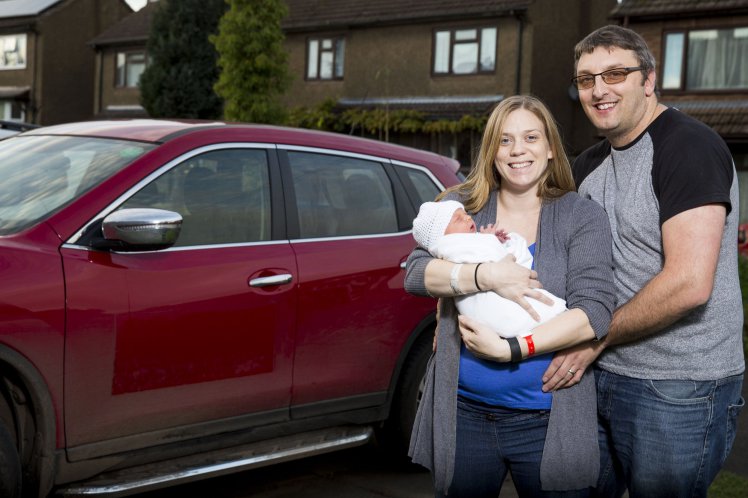 Stuart Blaze (40), Sarah Blaze (35), William Blaze (2 days), at their home in The Hobbins, Bridgnorth, Shropshire. An ambulance worker was forced to give birth in a car at the side of the road because she was too embarrassed and didn't want her colleagues to see her in an "undignified state". See NTI story NTIBIRTH. Sarah Blaze, 35, was sent home from hospital and told she was in early labour at 10pm on Friday (11/11). But when her waters broke at home an hour later she refused to call an ambulance because she didn't want colleagues to see "all of her". Instead she decided to get her husband Stuart, 40, to drive her 15 miles to New Cross Hospital in Wolverhampton, West Mids. The couple were forced to pull over on the Bridgnorth Road in Wightwick, West Mids., at 12.26am on Saturday (12/11) when Sarah felt the urge to push. Incredibly, Stuart didn't even have time to get out of the driver's seat before he had to help deliver William in their red Nissan X-Trail. The heroic dad even managed unwrap the umbilical cord which had got stuck around the newborn baby's neck. An ambulance then arrived two minutes later to take Sarah and William, who weighed 8lbs 2ozs, to hospital to be checked over.