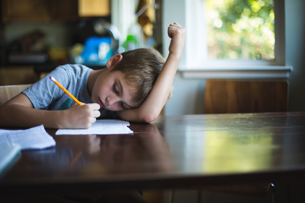 Boy Doing Homework at Table