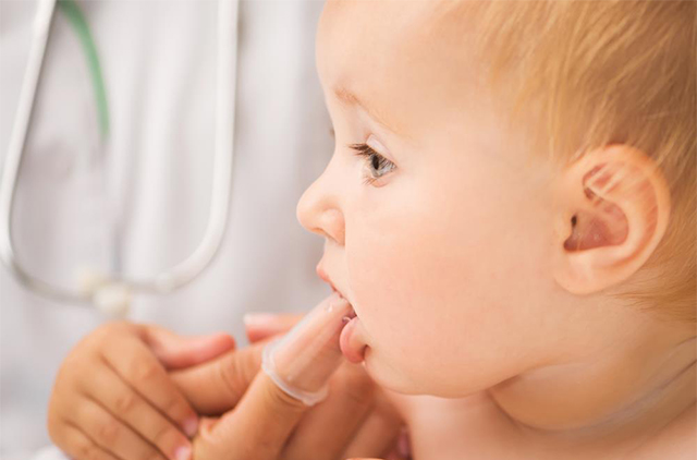 baby-with-finger-cleaning-massaging-gums
