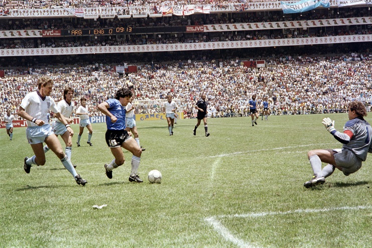 Argentinian forward Diego Armando Maradona (3rd L) runs past English defender Terry Butcher (L) on his way to dribbling goalkeeper Peter Shilton (R) and scoring his second goal, or goal of the century, during the World Cup quarterfinal soccer match between Argentina and England on June 22, 1986 in Mexico City. Argentina advanced to the semifinals with a 2-1 victory. (Photo credit should read STAFF/AFP/Getty Images)