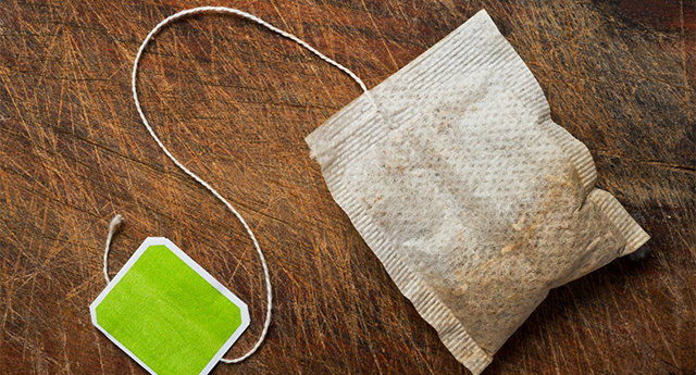 Tea bag on wooden table.; Shutterstock ID 86106523; PO: The Huffington Post; Job: The Huffington Post; Client: The Huffington Post; Other: The Huffington Post