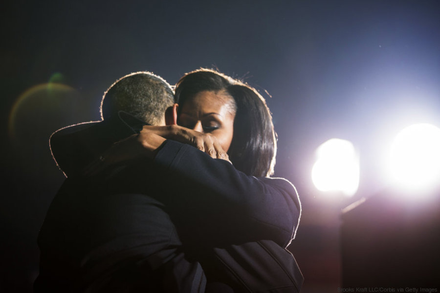 U.S. President Barack Obama hugs first lady Michelle Obama at a campaign rally in Des Moines, Iowa. (Photo by Brooks Kraft LLC/Corbis via Getty Images)