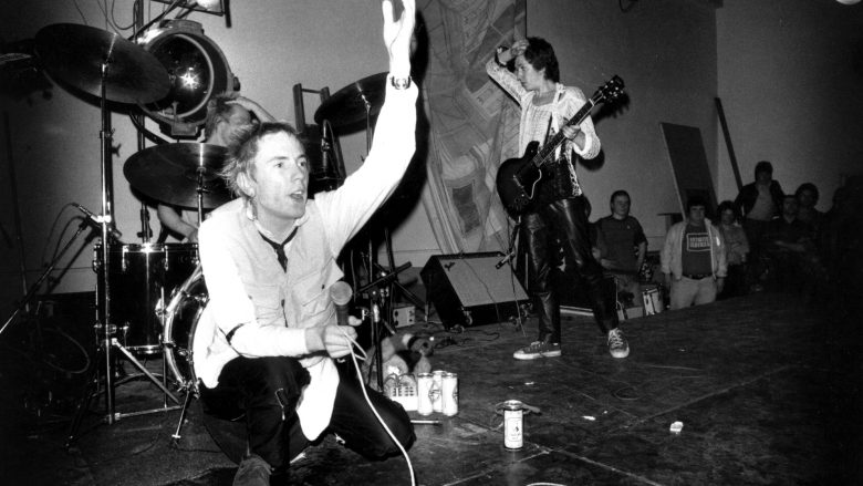 8th December 1976:  The Sex Pistols: Johnny Rotten (John Lydon), Paul Cook (drums) and Steve Jones (guitar) performing on stage at Leeds Polytechnic, UK.  (Photo by Graham Wood/Evening Standard/Getty Images)
