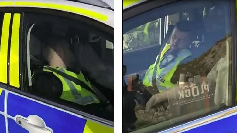 Polici filmohet duke bërë “një sy gjumë” pranë timonit, edhe pse motori i veturës ishte duke punuar (Video)