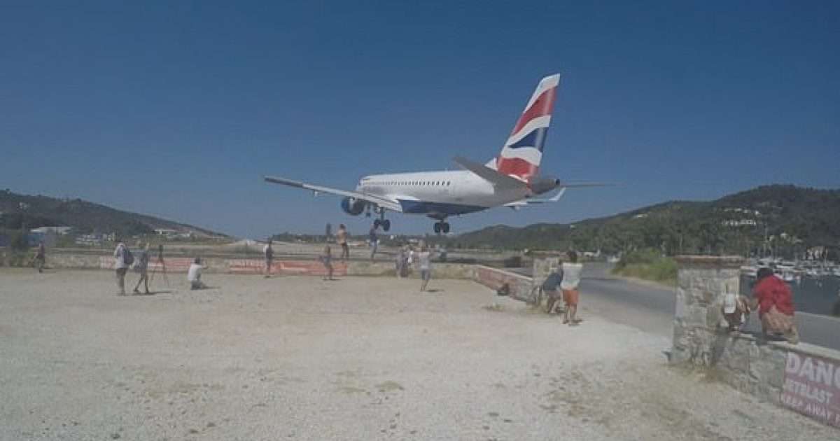 It flies just above their heads, the moment when tourists in Greece