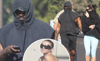 Kanye West mundohet të mos vihet re nga të tjerët, ndërsa shihet i shoqëruar nga një vajzë misterioze