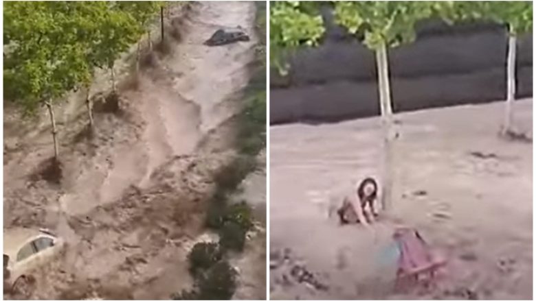 Veturat po notonin një pas një, e një grua mbeti e ngujuar në çatinë e makinës, pamje të rënda pas vërshimeve në Spanjë