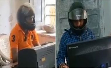 Punëtorët e një zyre qeveritare në Indi përdorin helmeta për t’u mbrojtur nga copëzat e tavanit të cilat bien mbi kokat e tyre