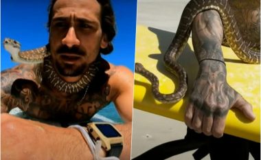 Australiani gjobitet për ‘sërf’ me kafshën e tij, i trembi të gjithë në plazh kur u shfaq me piton