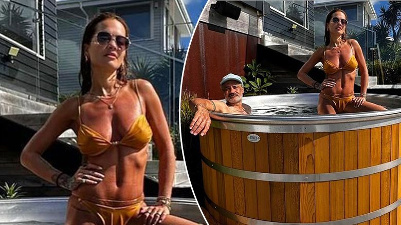 Rita Ora tregon figurën e saj mahnitëse në bikini ndërsa relaksohet në vaskë të nxehtë, me bashkëshortin e saj Taika në Zelandën e Re