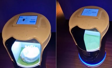 Roboti i shërben ushqim një klienti në një dhomë hoteli në Kinë
