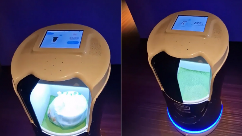 Roboti i shërben ushqim një klienti në një dhomë hoteli në Kinë