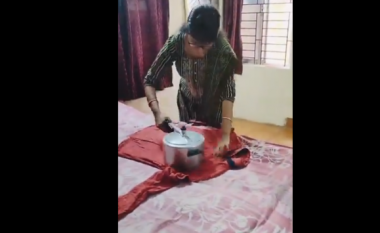 Habit teknika e gruas për hekurosje – në vend të hekurit ajo përdor tenxheren e nxehtë