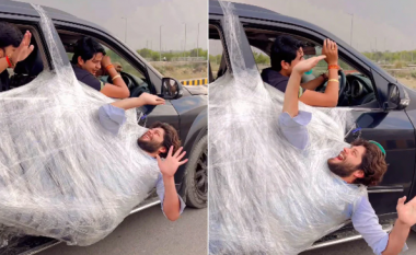 Marifet i rrezikshëm - burri shijon vozitjen i mbështjellur me najllon dhe i varur në derën e veturës
