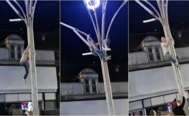 Dëshmitarët “të trembur” teksa një burrë ngjitet në shtyllën rreth 6 metra të lartë për të shpëtuar pulëbardhën e bllokuar
